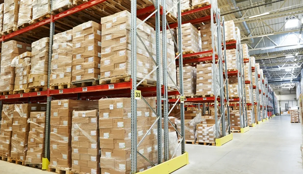 Warehouse storage aisles with palletized cartons