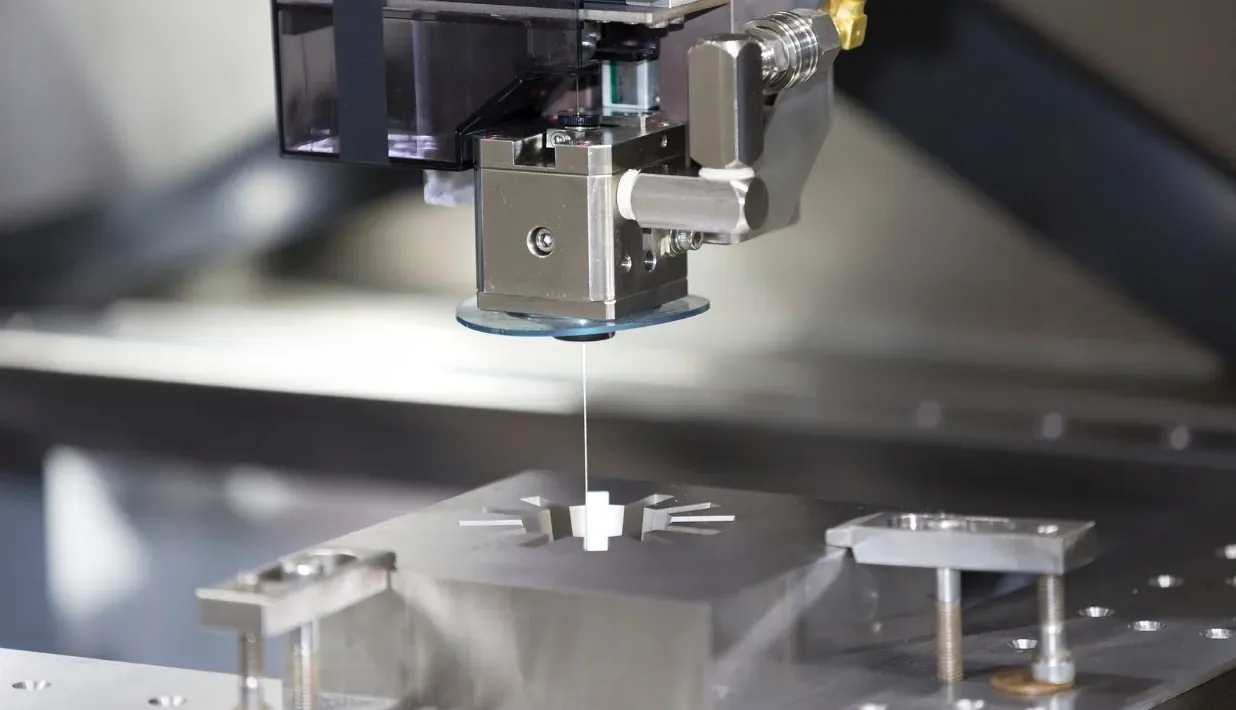 Close-up of a generic manufacturing machine handling a small workpiece